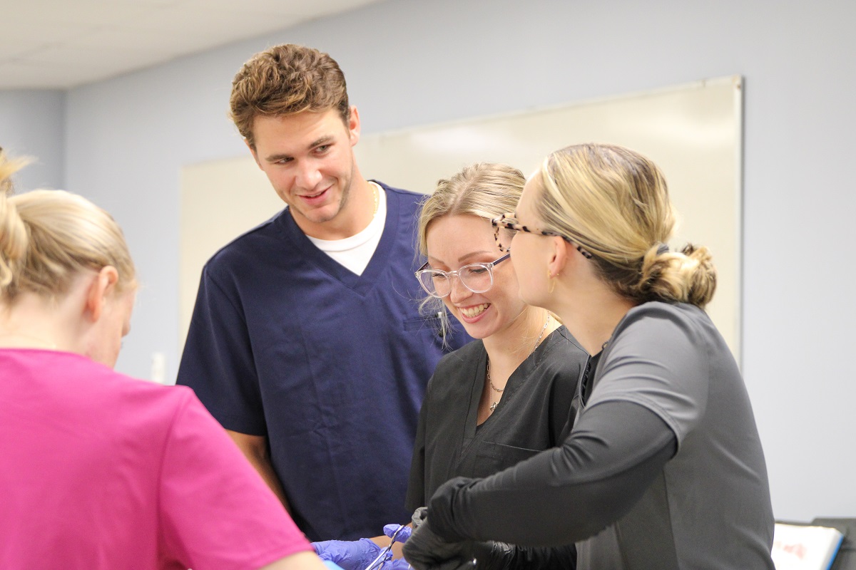 ${ Physical therapy students work together in the Anatomy Lab }