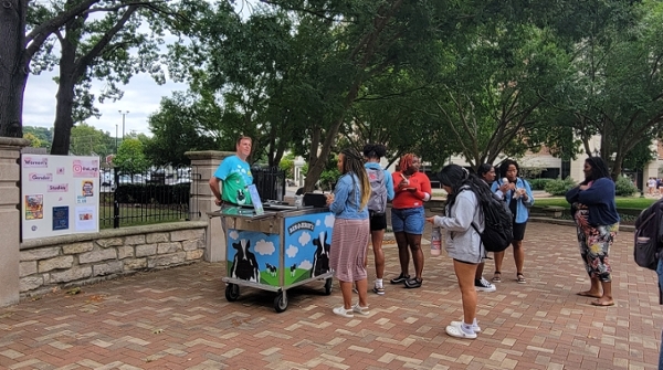 A picture of Humanities Plaza, with Ben & Jerry's serving ice cream to students. 