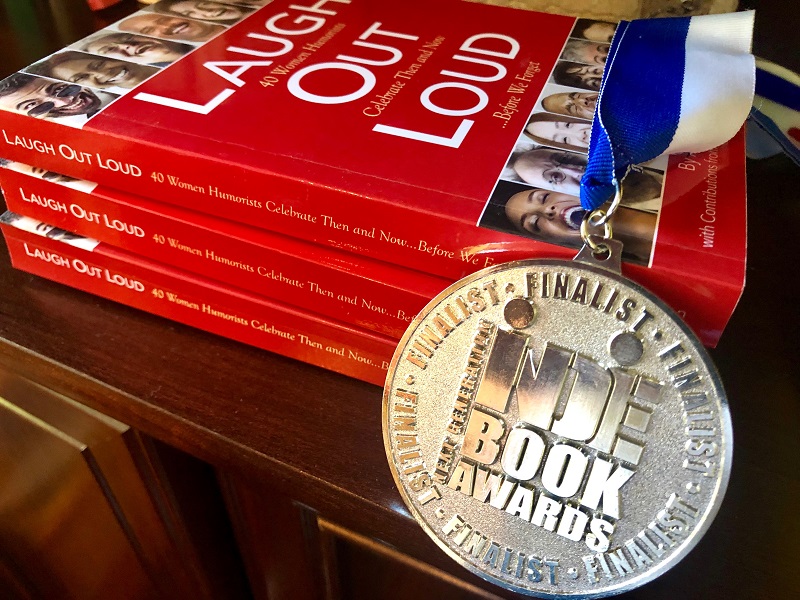 Indie award on a stack of Laugh out Loud anthologies