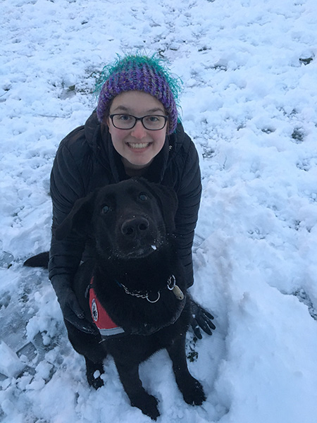 Darling, service dog in training, with Julia on the University of Dayton campus in winter of 2016.