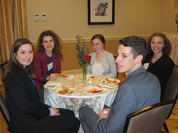 Students network with alumni at Capital Hilton reception.