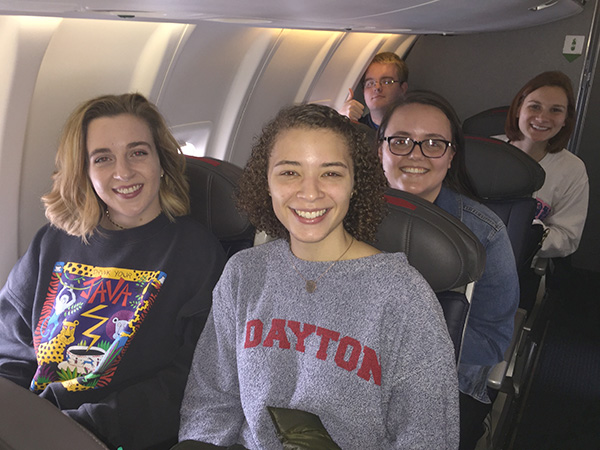 Students Katherine Liming, Eden Williams, Thomas Ferrall, Emily Haynes and Lauren Durnwald (L-R) aboard the plane to Washington, D.C.