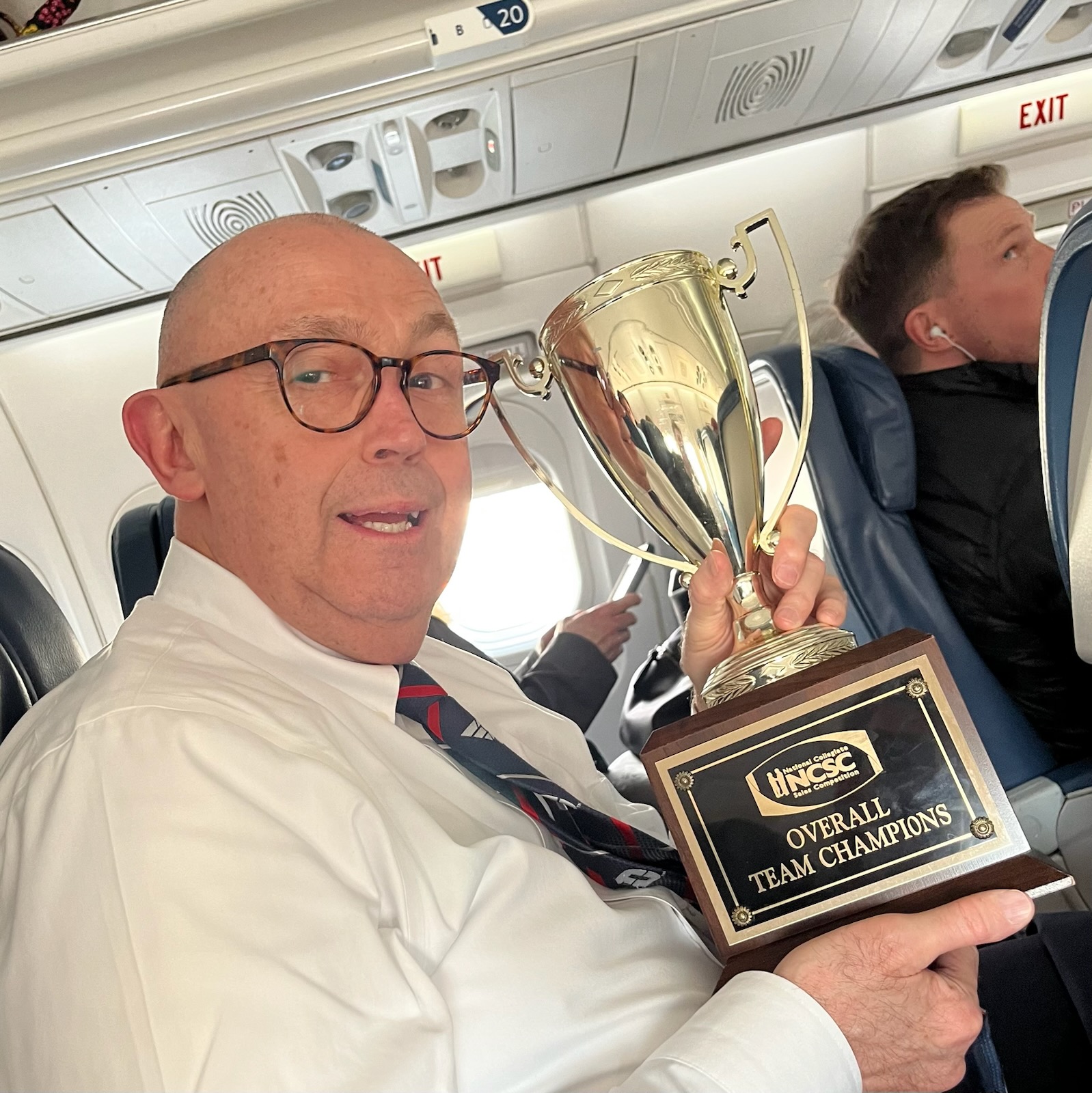 Tony Krystofik, the Director of the Fiore Talarico Center for Professional Selling and Sales Coach holding the trophy on the way back home to Dayton. 