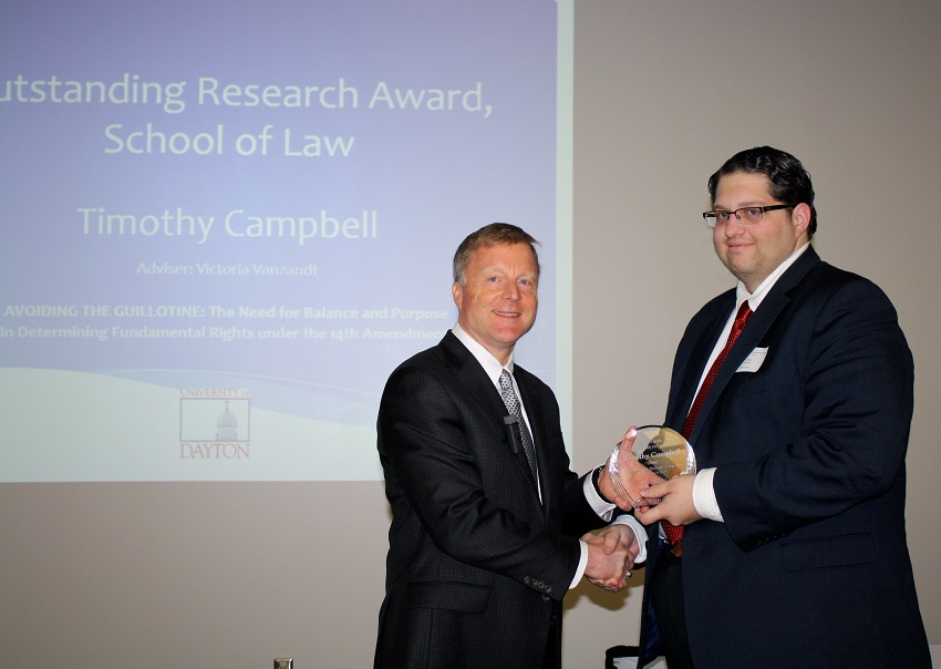 Timothy Campbell '16 receiving the 2016 Graduate Showcase Award for Law Student Scholarship