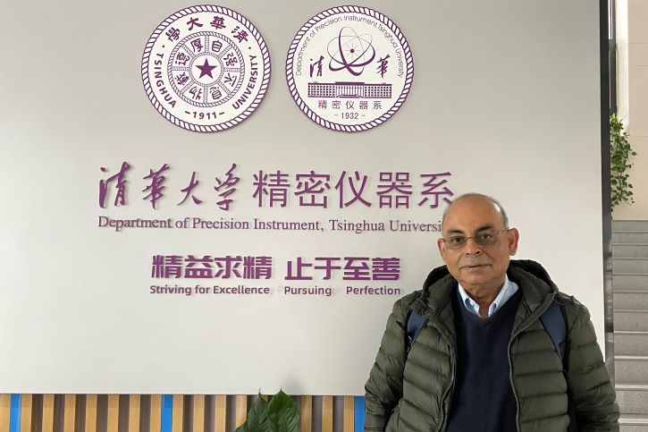 Dr. Banerjee in the forefront of Tsinghua University sign