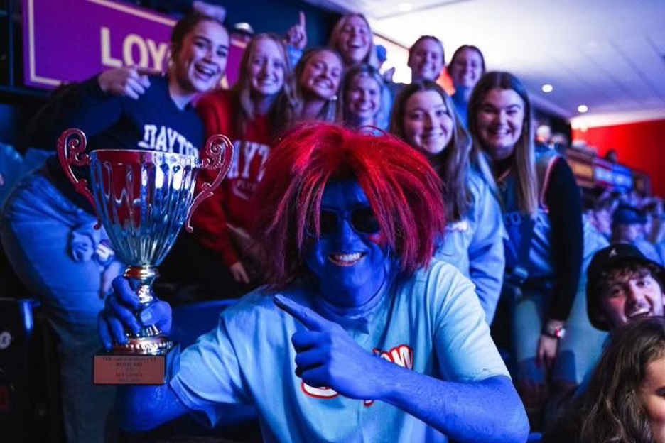 Ryan Peaco and other students with blue body paint and red wigs.