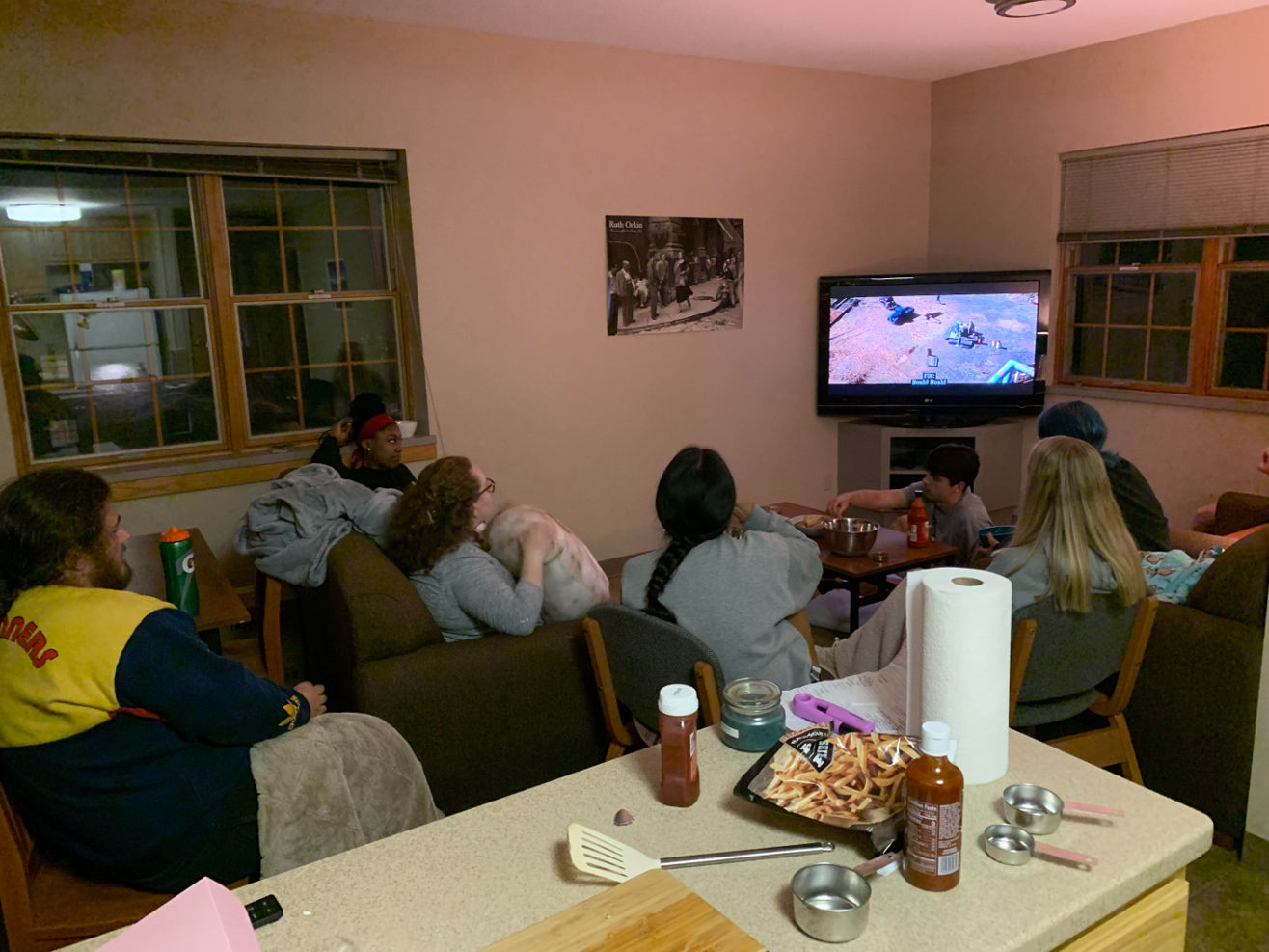 This image depicts some of the 2022 summer BSTI students having a spontaneous watch party of the Notebook one evening after a day of research!