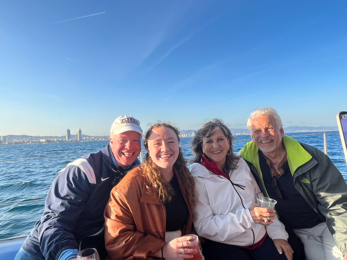 The family of Tara McLoughlin visiting her during Easter Break. Her father Brian (pictured on the left)  traveled with her to Barcelona with close family friends Jim and Su Lee (pictured on the right of Tara) all the way from Texas! This  photo was taken on a sunset boat cruise on the Mediterranean Sea. 