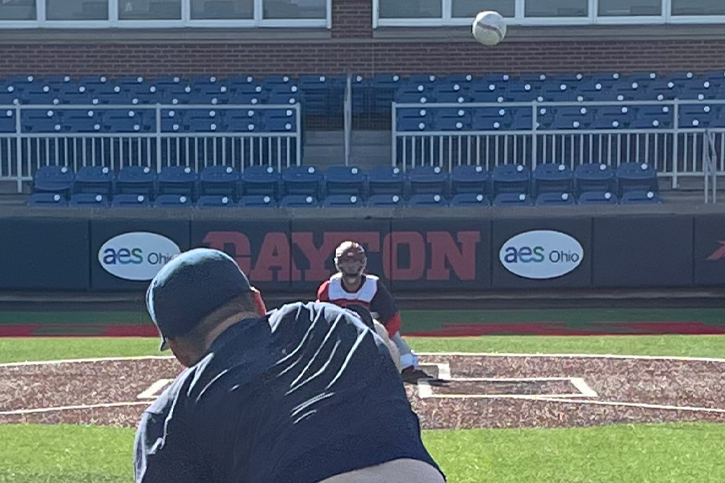 A Flyers pitcher throwing to a catcher