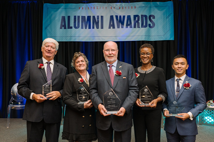 Photo of our 2023 University of Dayton Alumni Assocation Alumni Awards. Robert Kohorst, Larry Woerner, Lisa Payne Wansley, Valerie Dahlem and Micahel Sia.