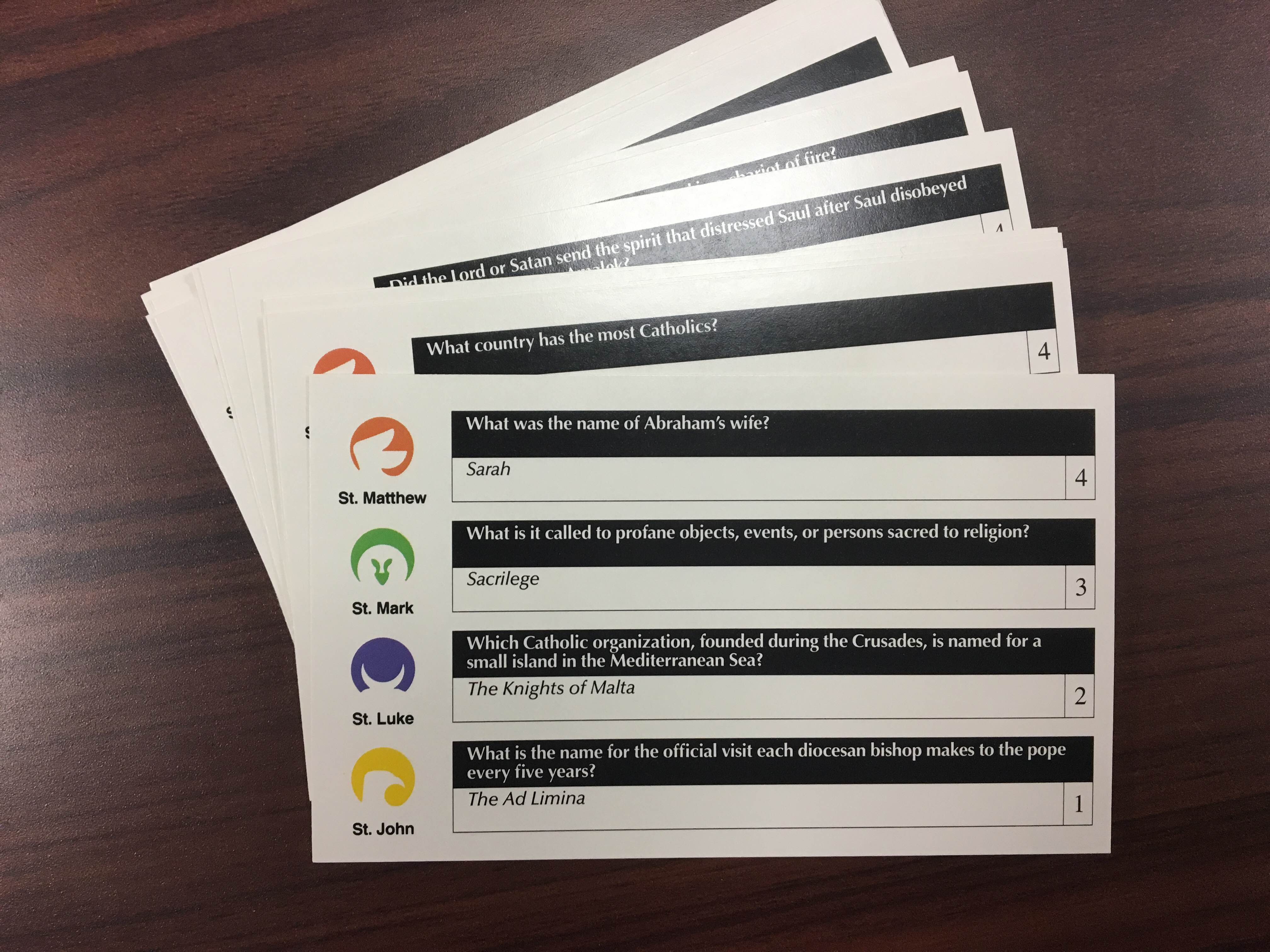 Sample trivia cards, with categories for St. Matthew, St. Mark, St. Luke, and St. John, the four evangelists.
