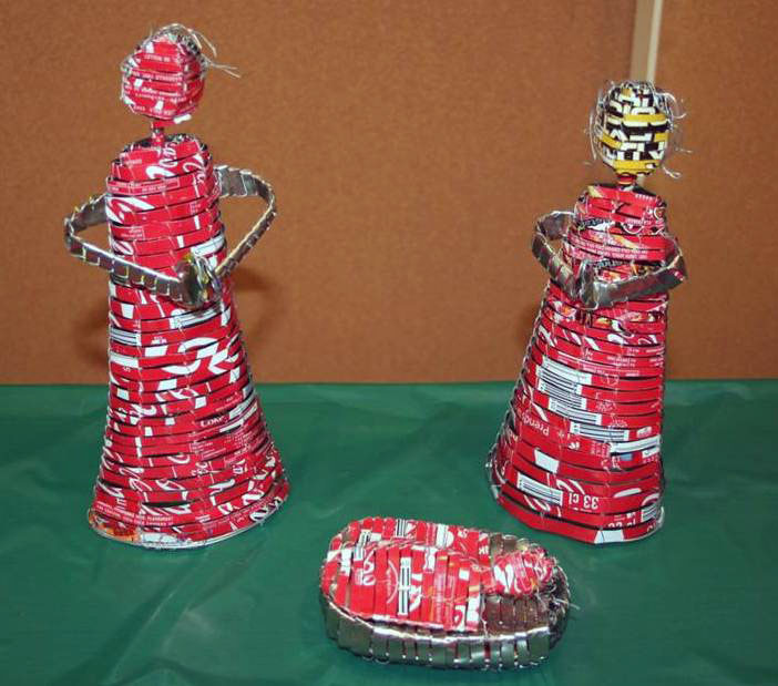 Holy family formed from recycled Coca-Cola cans