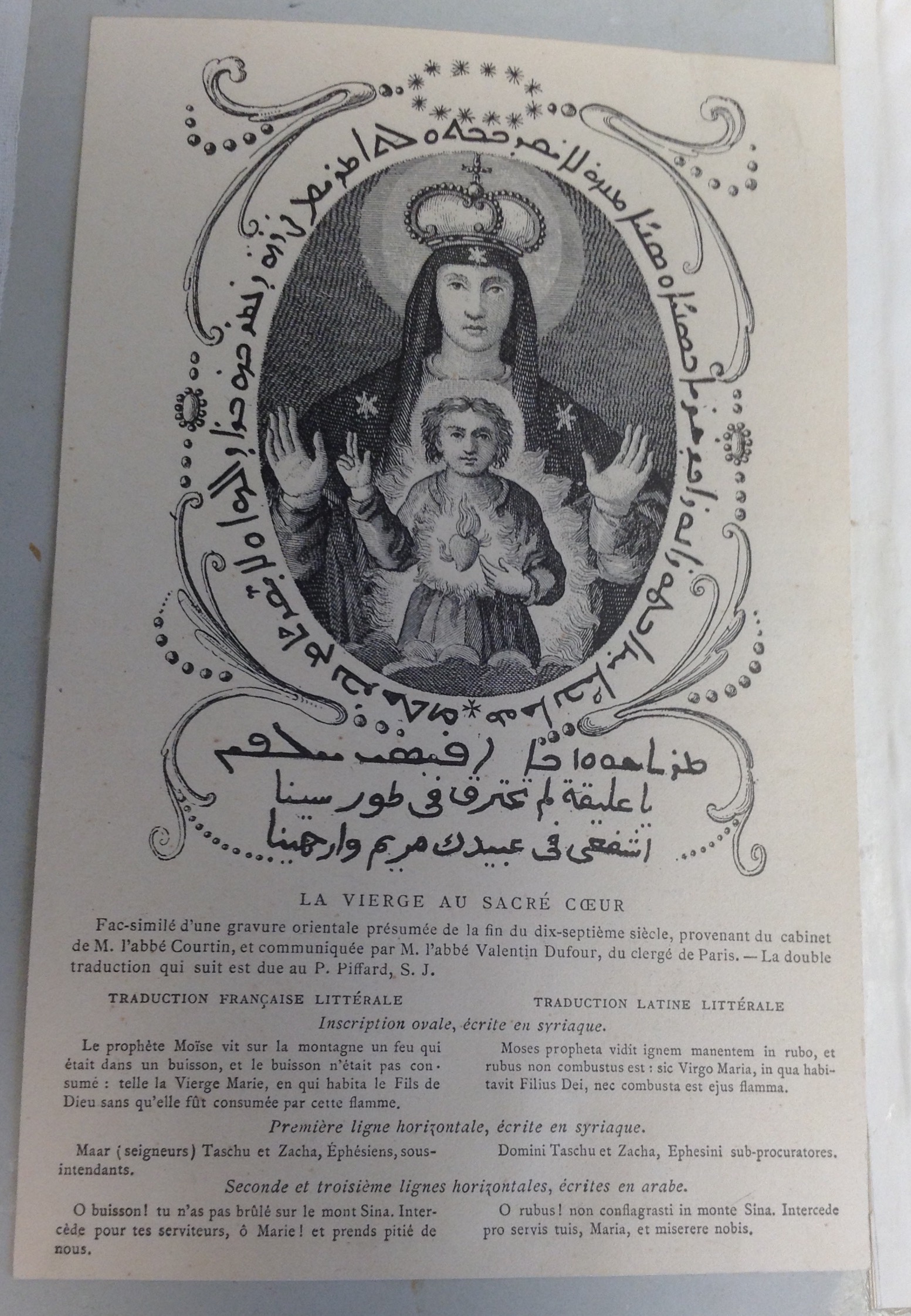 Page which includes a black and white engraving of La Vierge au Sacre Couer