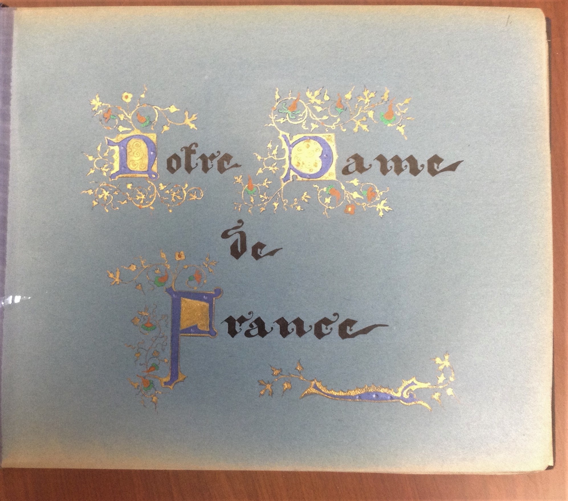 Words "Notre Dame de France" in calligraphy and embellished