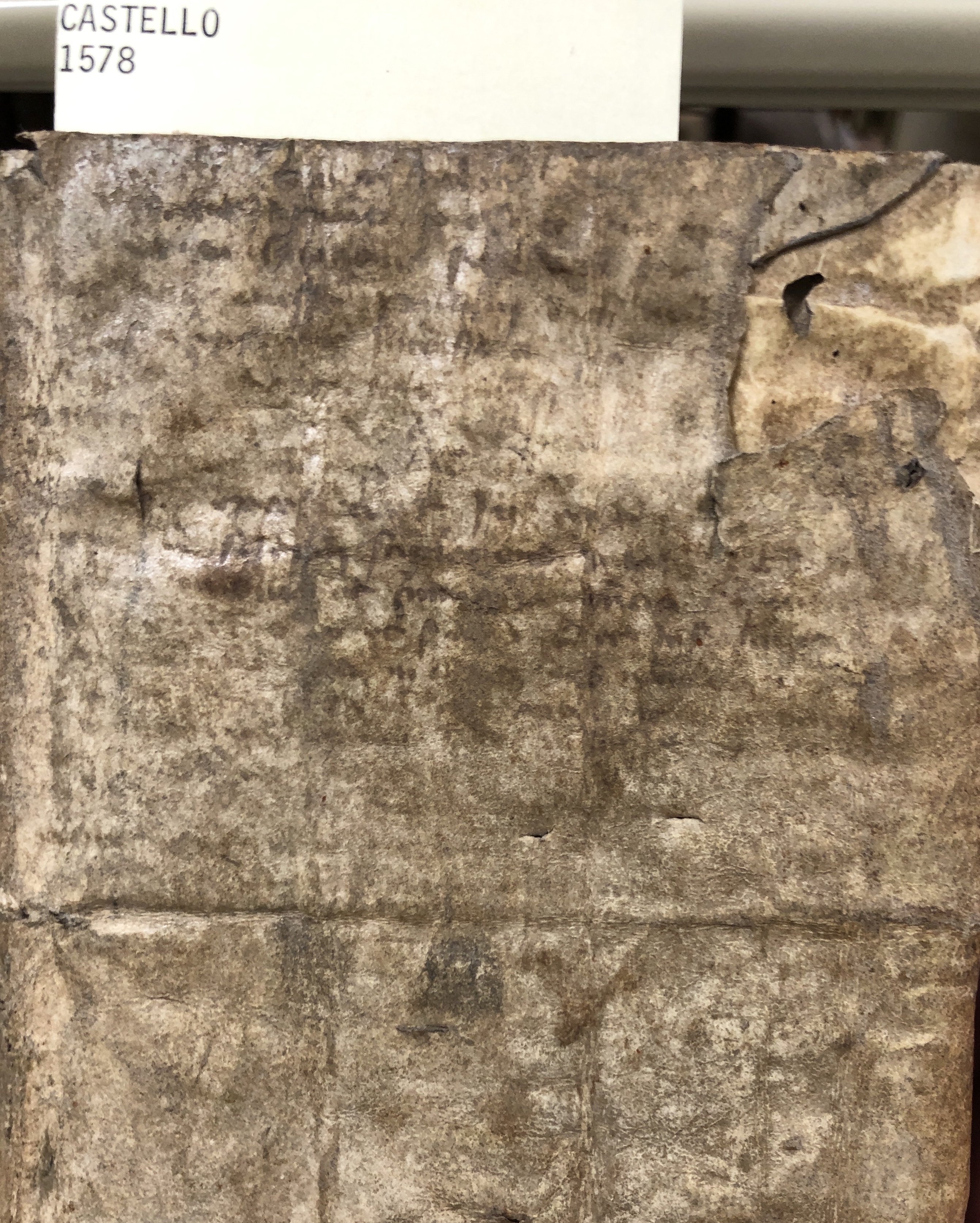 The manuscript writing on the cover of this 1578 book on feast days is faint and illegible