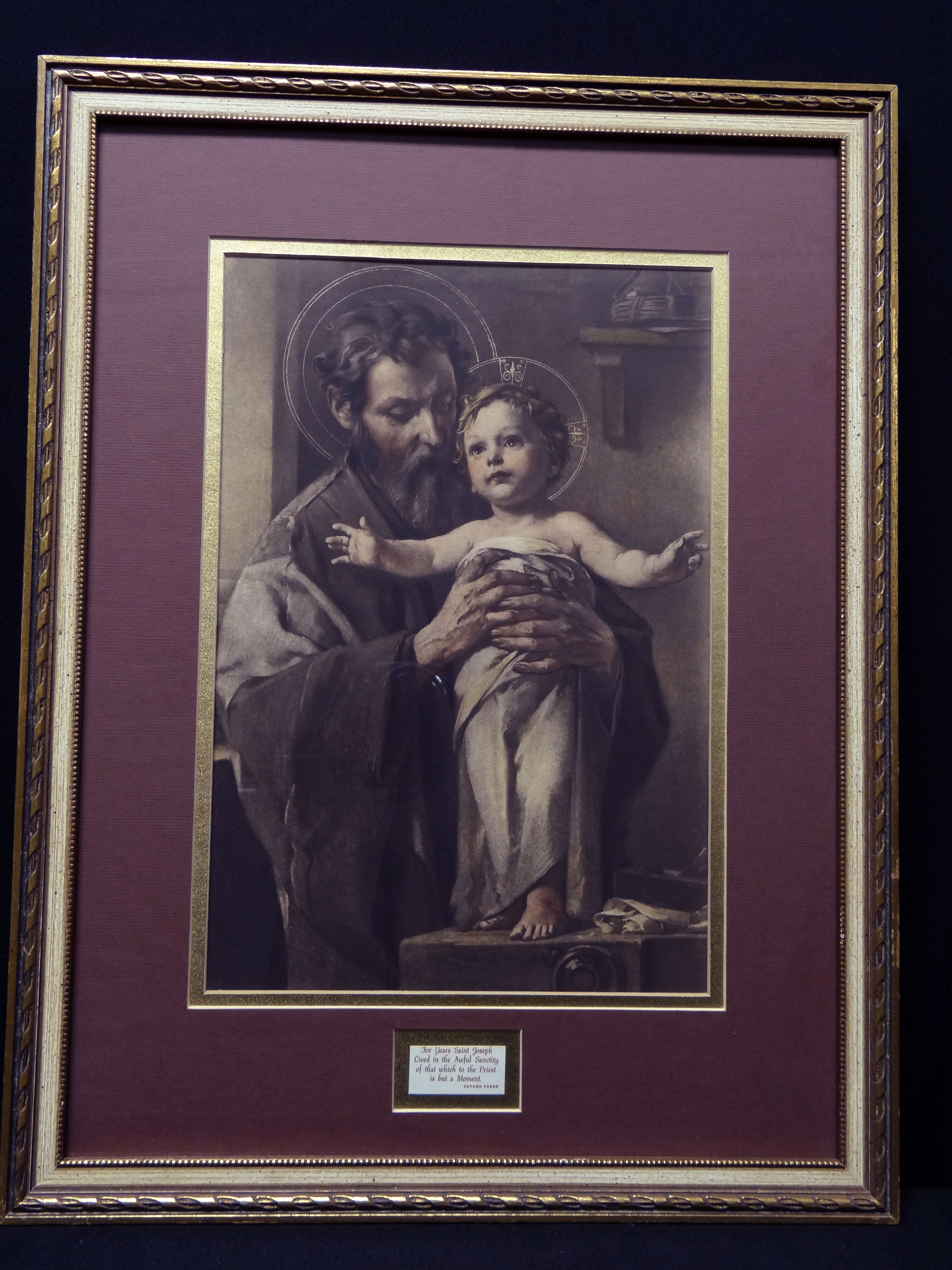 Saint Joseph holding the Child Jesus, whose arms are outstretched, up near his cheek. Child is swaddled. Both have halos.
