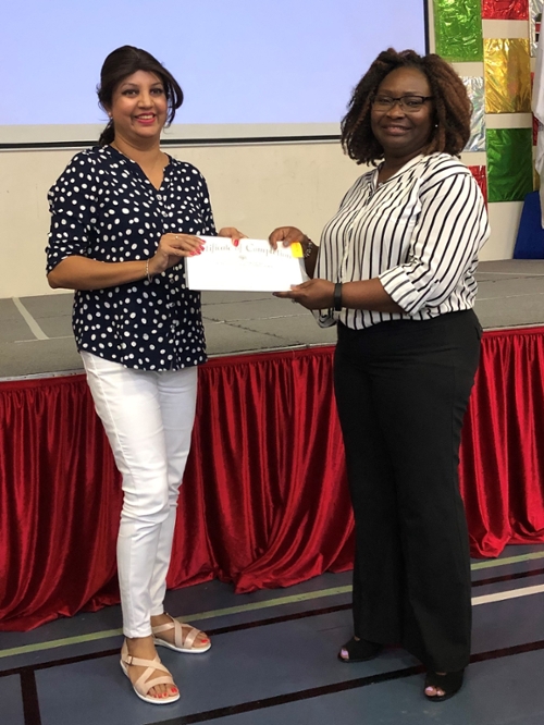 Dr. Dorothy Mensah-Aggrey (right) presenting certificate in UAE.