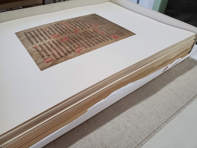 Picture of medieval manuscript leaves in a stack