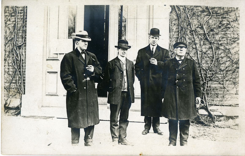 Four men outside St. Mary's Hall, University of Dayton, 1913