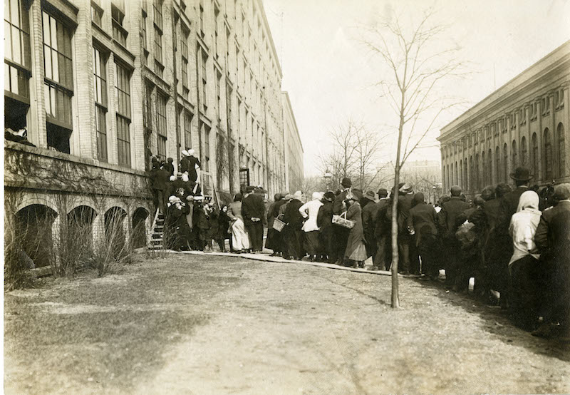Daytonians displaced by the 1913 flood took shelter at NCR. Here, they wait in line for entry.