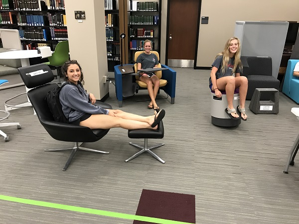 Students testing furniture