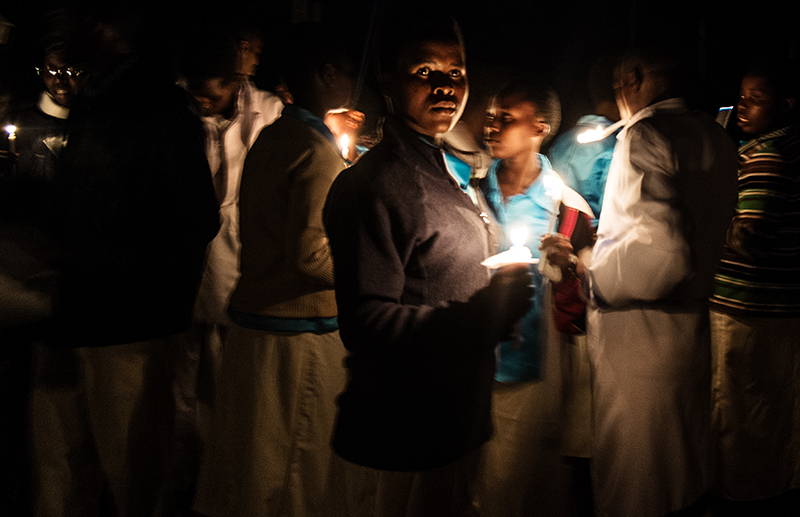 Evening prayer outside the Shrine of Our Lady of Sorrows, the Marian sanctuary in Kibeho. Photo by Gianmarco Maraviglia.