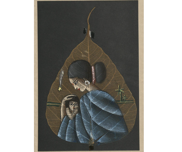 Collage-style Christmas card featuring an image of the Madonna and Child hand-painted on a bodhi leaf. The leaf is mounted on a piece of black card stock, which is glued to the card front. The image depicts Mary in a blue robe cradling a young Jesus to her chest as she gazes down at him. Jesus is sucking on his thumb and looking out toward the viewer. In the background are green and yellow horizontal lines representing faraway fields. Two yellow and green palm trees appear in the distance on the right, and a yellow shooting star with a white trail representing the Star of Bethlehem appears on the left. 