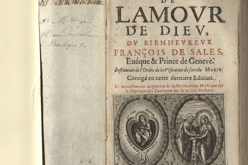 Detail of the front page from Traicté de L’Amour de Dieu, a book from 1647. Text is in French and the main text is the title as well as "Francois de Sales." Side-by-side images near the bottom of the page appear to be of the Sacred Heart and the Visitation.