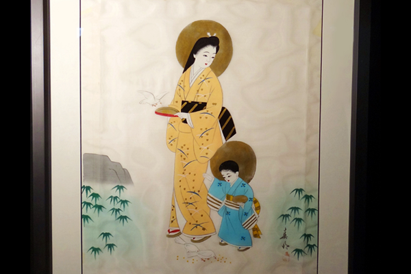 Silkscreen of an Asian Madonna looking down toward a young Jesus who is standing on her right.