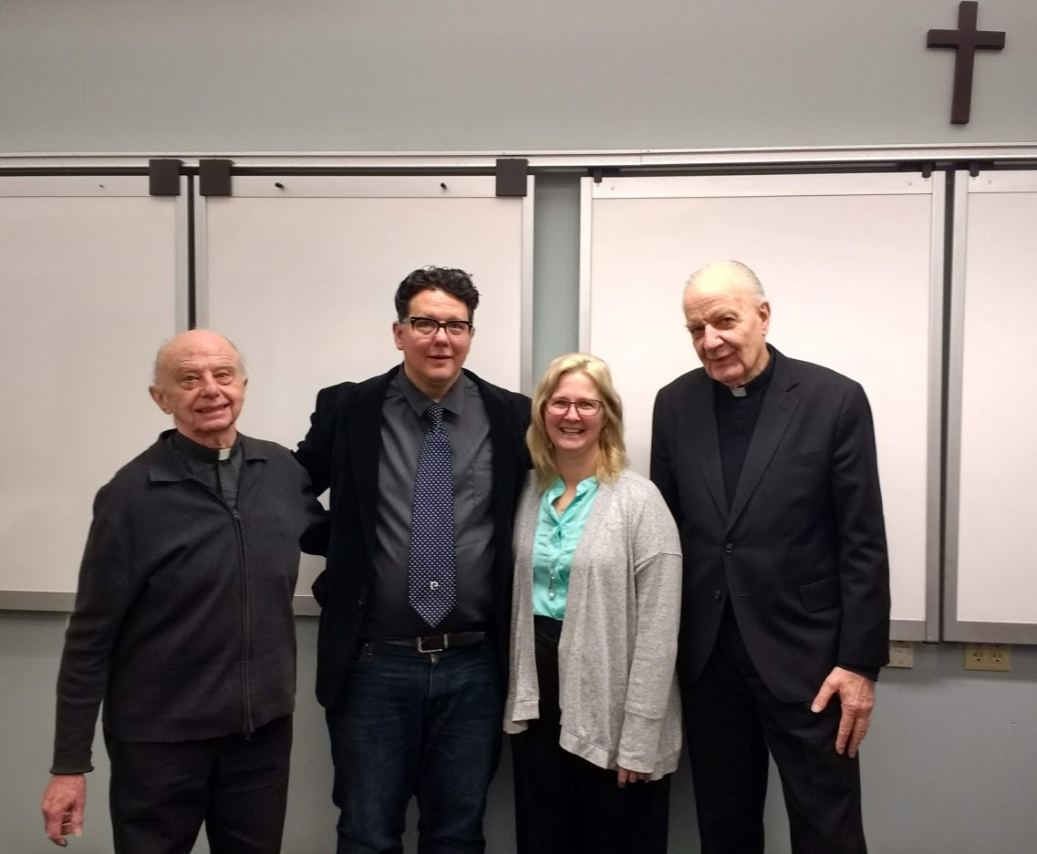 From left, Father Thomas Thompson, S.M., Christopher Padgett, Linda Padgett and Father Johann Roten, S.M., following Christopher Padgett’s thesis defense.