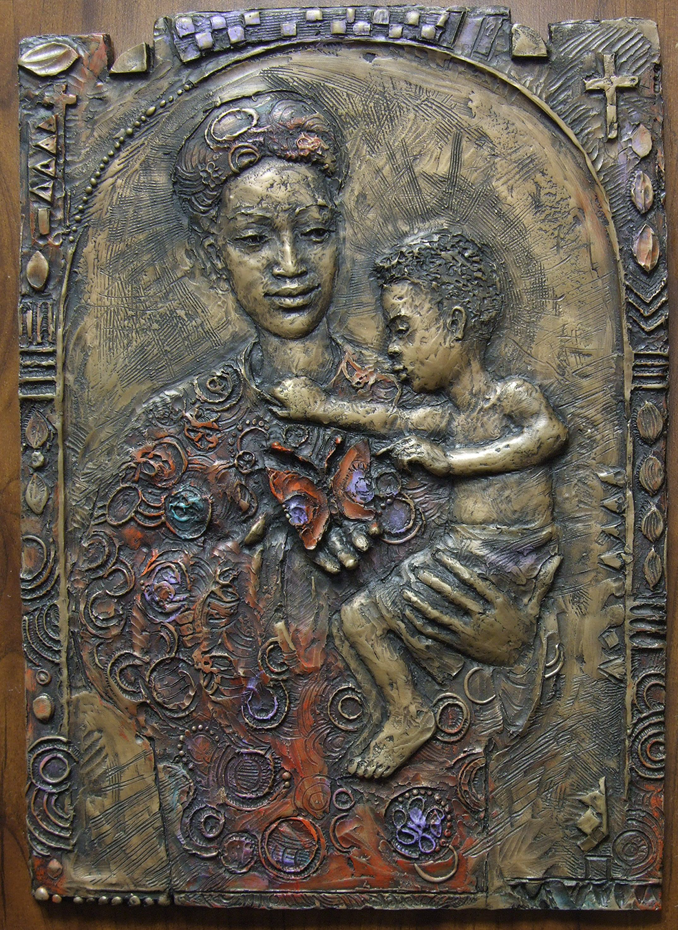 Hand-sculpted metal of Madonna and child 