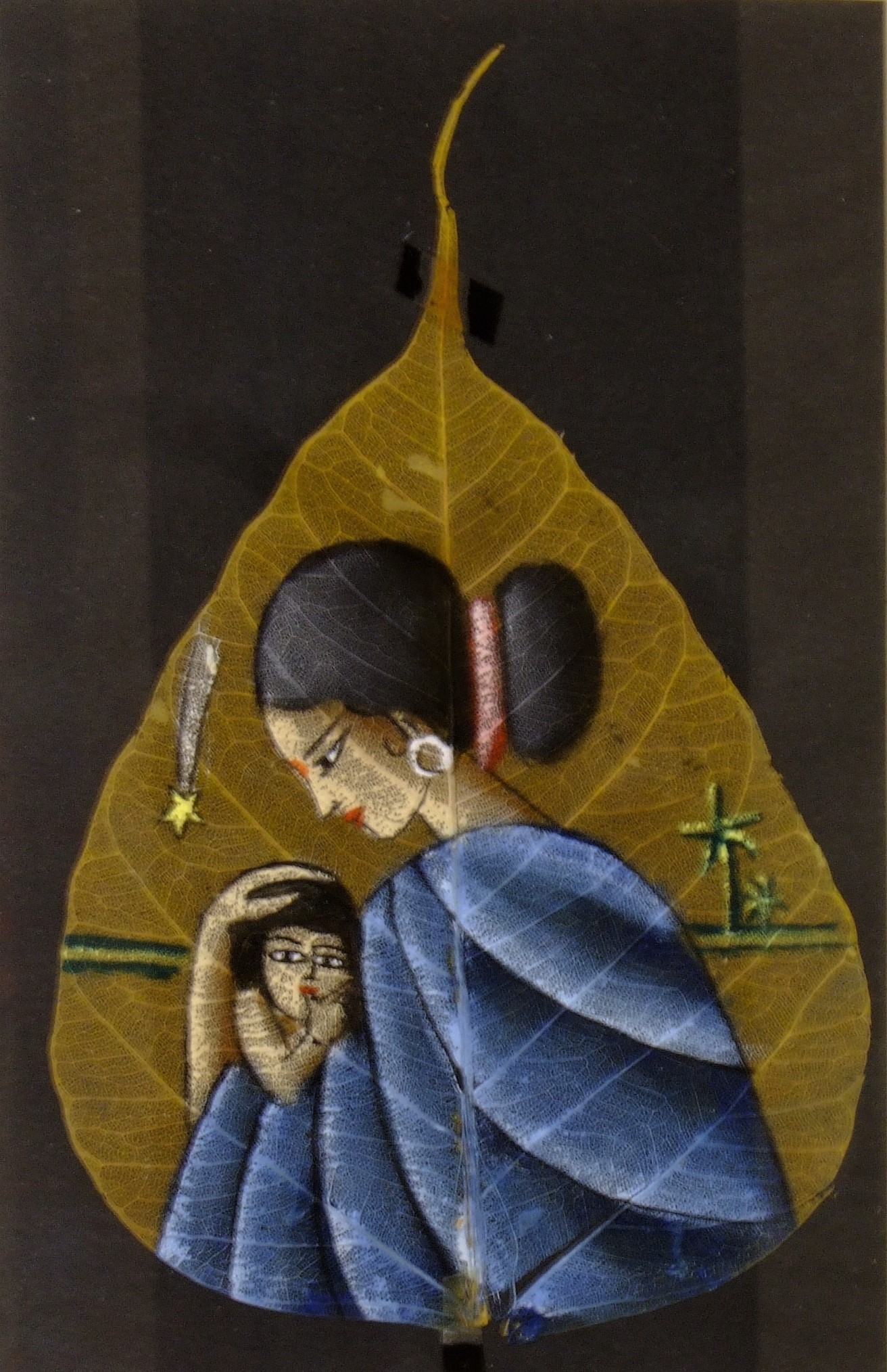 From India, this painting of the Madonna and Child on Bodhi leaf was created circa 1980.