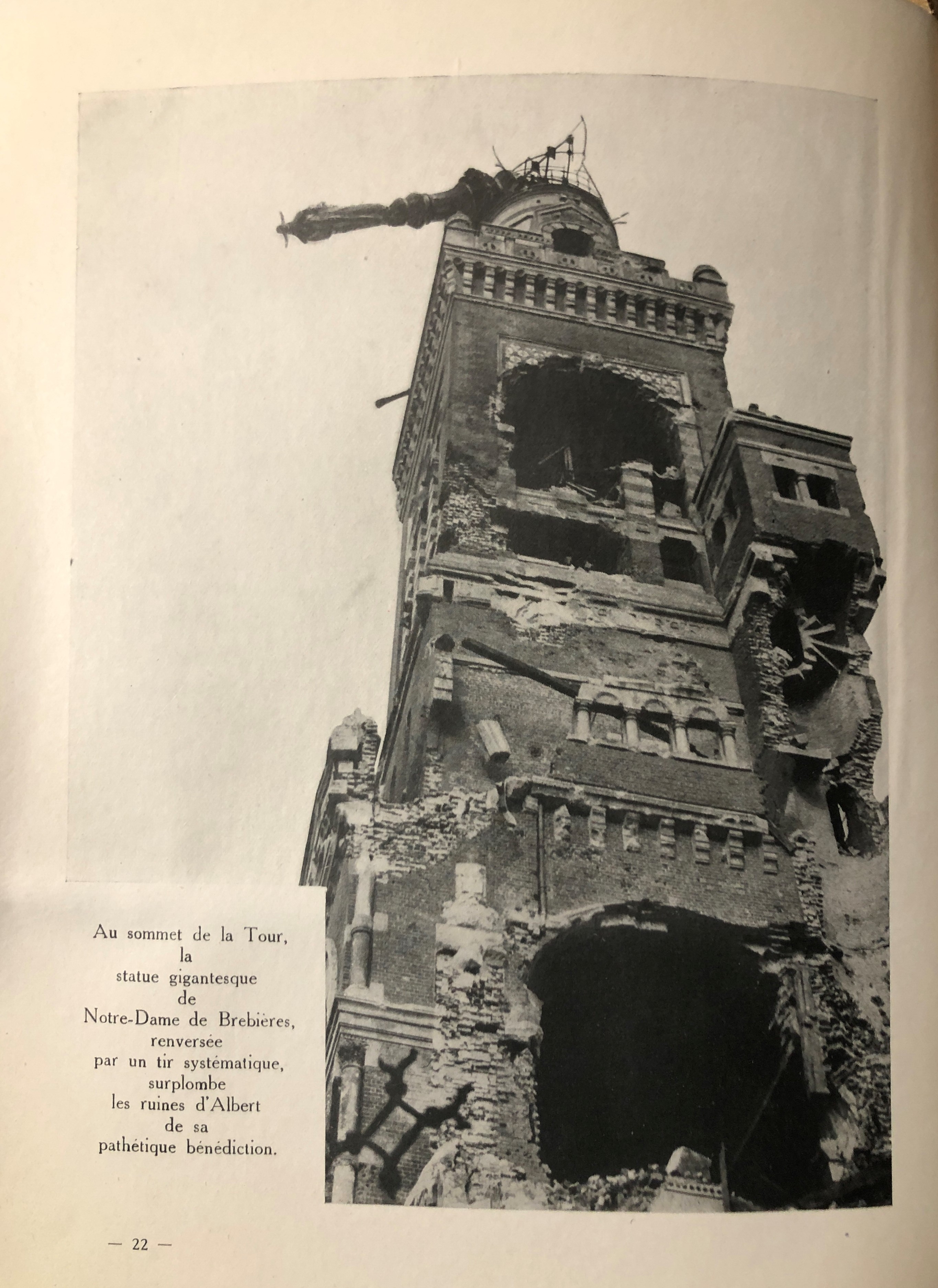 A photo of the destruction to the tower and statue basilica of Notre-Dame de Brebières, on the front lines of the Somme. The caption describes the Virgin and Child statue offering “pathétique bénédiction” to the surrounding ruins.