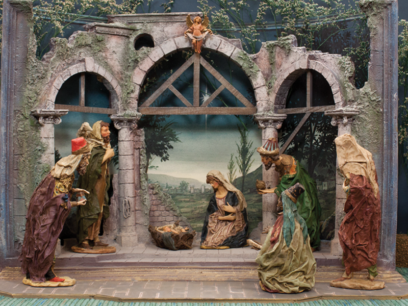This Italian representation of the three kings at the manger has a more traditional feel. Created by Angela Tripi and Peter Wolf, the figures stoop, bend and kneel as they reverently look upon the newborn king.