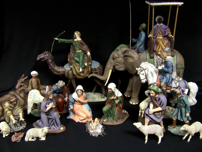 The three kings in this Nativity set from Mexico make a grand entrance on camel, horse and elephant.