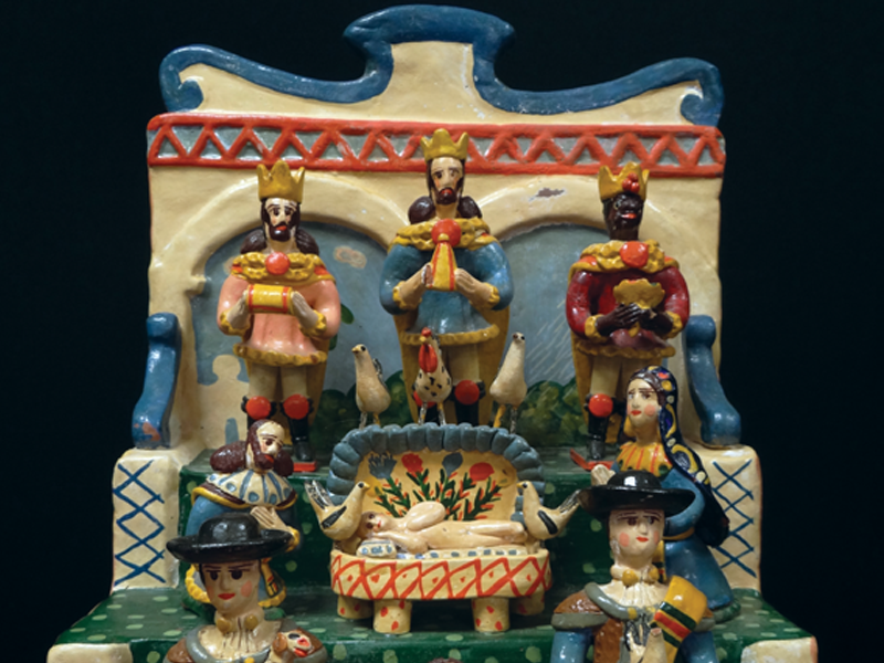 This Nativity by P. Ramalho is from Portugal. The three kings stand tall on the highest tier as they display their gifts for the child Jesus.
