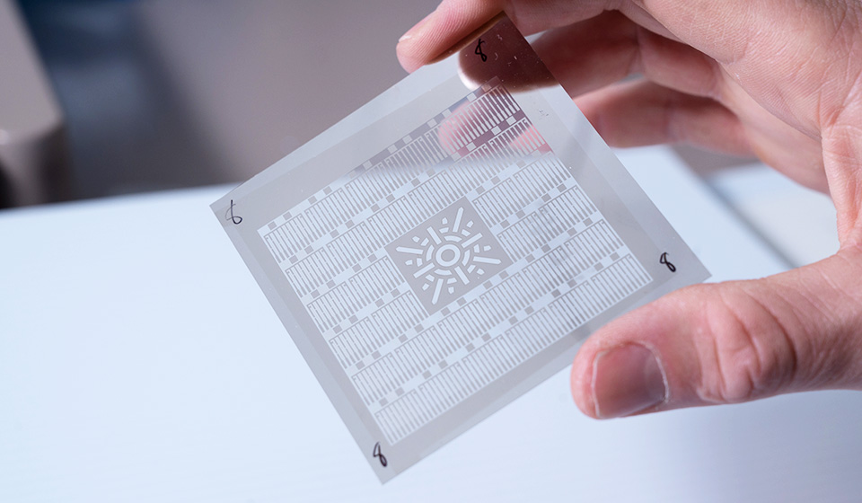 Small piece of flexible glass with sensors printed on it