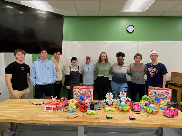 Engineering students modified and tested toys for children with disabilities in program with United Rehabilitation Services.