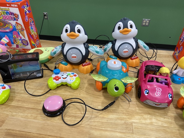 Toys modified by engineering students for children with disabilities.