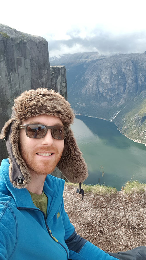 MIke Voellmecke, a 2011 University of Dayton graduate and the first with a minor in sustainability, enjoys the great outdoors in Norway's fjordland.