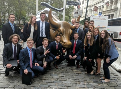 Students in front of the Wall Street bull in NYC