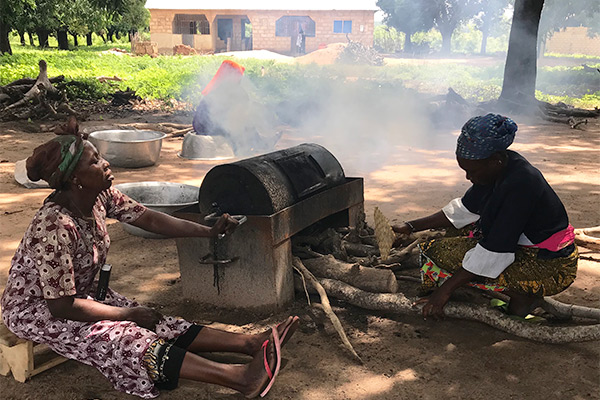 Women in Ghana processing shea butter