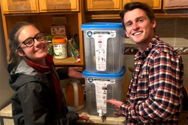 Sammy Miller and her partner Pat with a water filter for villages in Bolivia. 