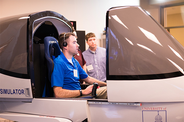 Test pilot in University of Dayton flight simulator during flight design test.