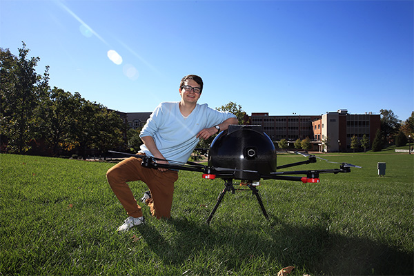 Gonzalo Perez, University of Dayton mechanical engineering technology alum, with Code E Drone innovation on the University campus.
