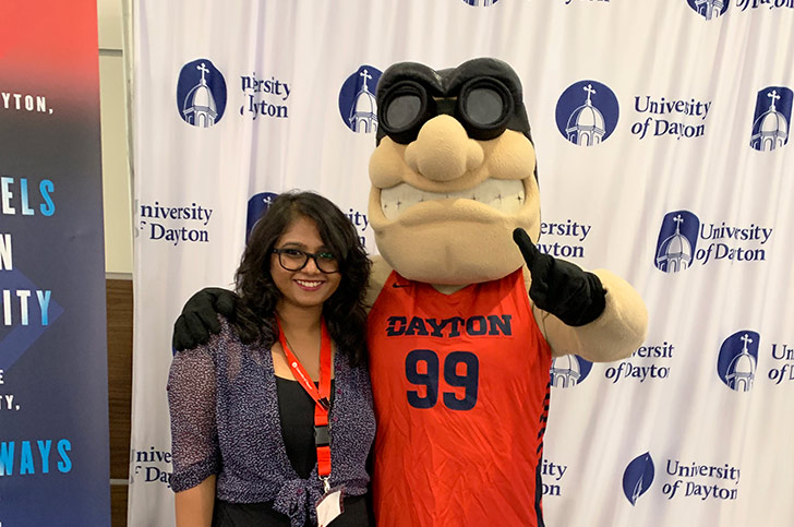 Bhargavi Ravi, engineering management graduate student and Rudy Flyer, University of Dayton mascot