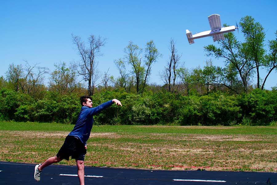 Launch of the airplane by the student for its maiden flight.