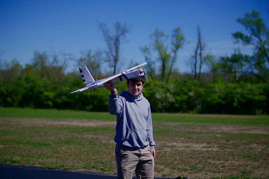 Student holding the airplane on runway before launching the aircraft.
