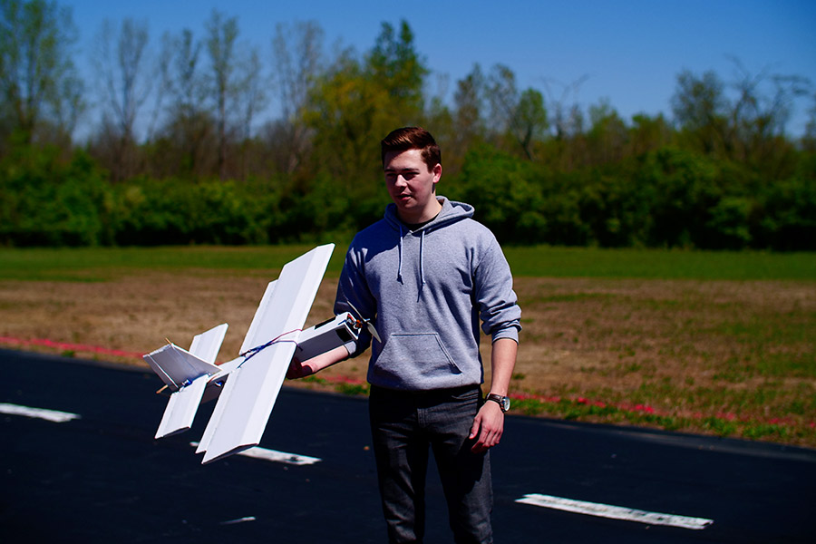 Student getting ready to launch the aircraft.