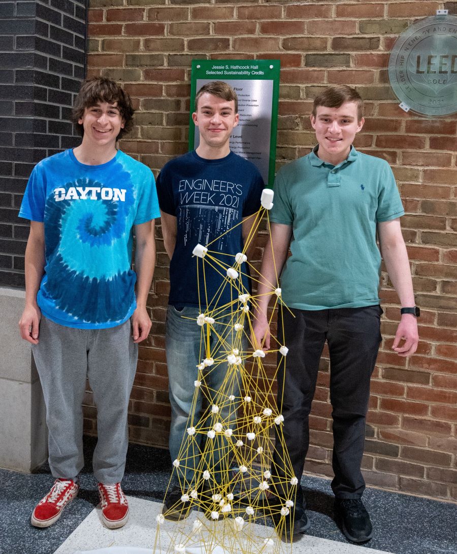 Spaghetti Tower Competition winning team standing beside their tower